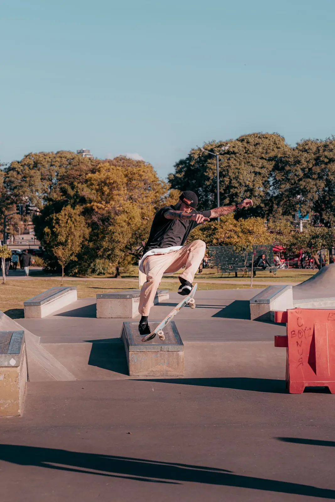 Skaters at a concrete skatepark