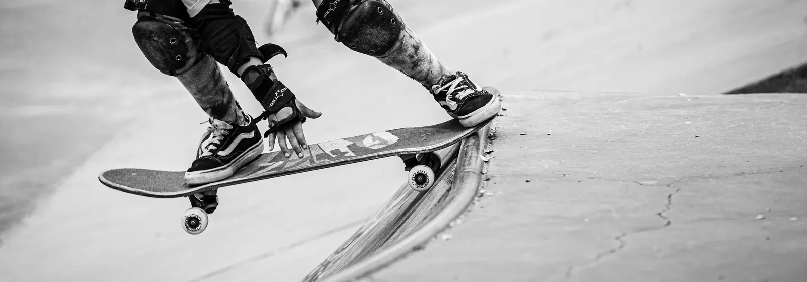 Skater in protective gear dropping in